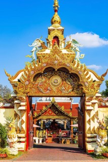Richly decorated portal at the entrance to the Wat Muen Toom temple complex, Old City Center,