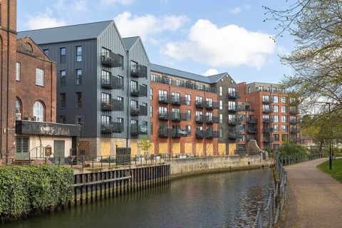 Modern housing development riverside apartments, St James Quay, River Wensum, Norwich, Norfolk,
