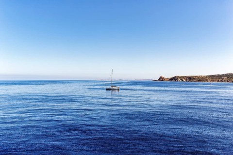 Sailing boat, Strait of Bonifacio, deep blue Mediterranean Sea, granite rocks, coastline near Santa