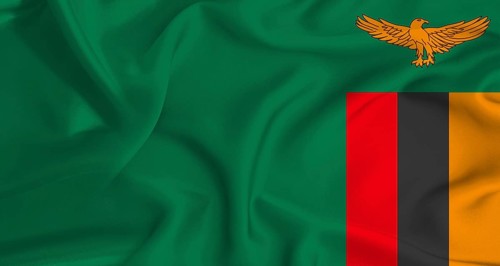 Realistic Zambia flag waving. Close up of flag of Zambia with cloth texture