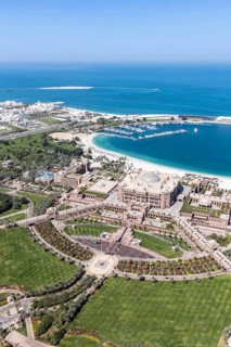 Abu Dhabi skyline from above with Emirates Palace in Abu Dhabi, United Arab Emirates
