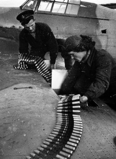 An English and a Russian pilot check the fighter pilot's cartridges. Northern Front, Murmansk,