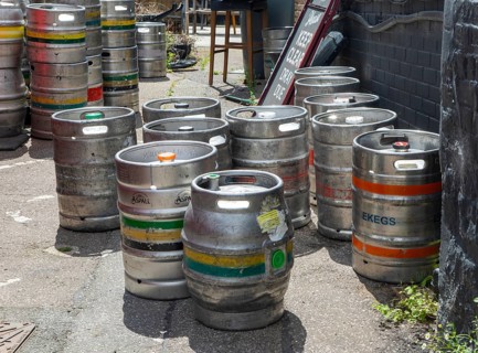 Beer barrels kegs in pub yard, Woodbridge, Suffolk, England, UK