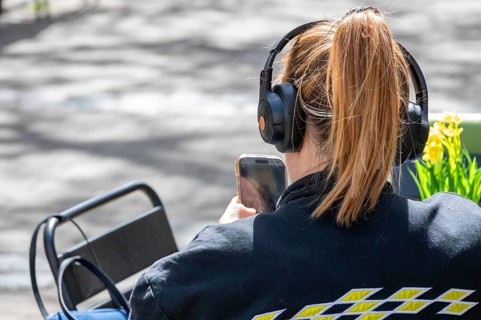 Young woman with headphones and cell phone, Bavaria, Germany