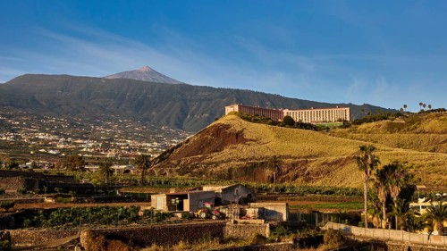 Puerto de la Cruz, panoramic view of volcanic landscape with historic buildings at the golden hour,