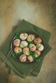 Grape snails stuffed in Burgundy, with butter and herbs, French cuisine, no people