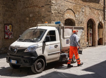City cleaning employee with his vehicle, Pienza, Tuscany, Italy