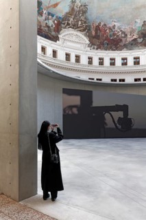 Bourse de Commerce, Pinault Collection, visitor photographed in the historic rotunda, concrete