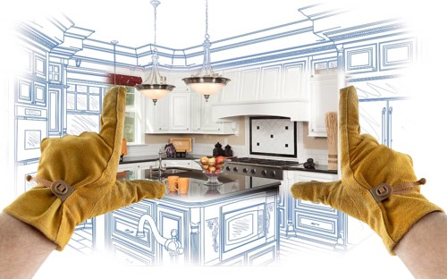 Male Contractor Hands Framing Completed Section of Custom Kitchen Design Drawing