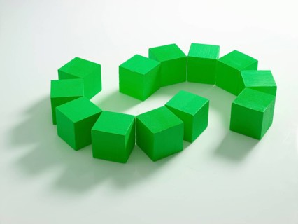 12 green wooden cubes against a white background