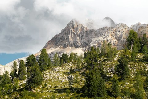 Dramatic mountain peaks colorful rocky scree slopes scenic alpine vista cloudy overcast sky