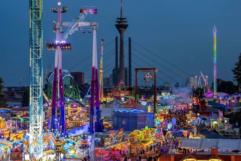 Rhine fair in the Rheinwiesen in Düsseldorf-Oberkassel, view towards the Rhine Tower,