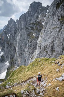 Mountaineer with helmet on a hiking trail, Wilder Kaiser, Kaiser Mountains, Tyrol, Austria