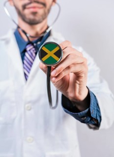 Jamaica health and medical insurance concept. Jamaica healthcare system, doctor holding stethoscope