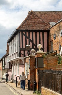 Historic timber-framed buildings entrance to Tymperleys, Trinity Street, town centre of Colchester,
