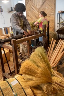 Berea, Kentucky - Aja Haynes (left) and June Rosenbarker make traditional Appalachian brooms and