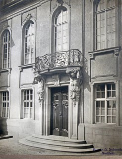 Historic building entrance with artistic sculptures and a decorative balcony, architecture, Eugen
