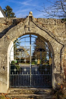 Cemetery gate at St. Stephen's Church in the desert of the village and today the ghost village of