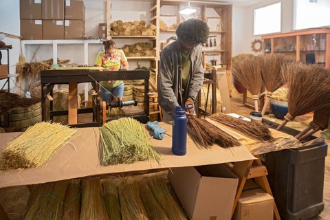 Berea, Kentucky - Aja Haynes (right) and June Rosenbarker make traditional Appalachian brooms and