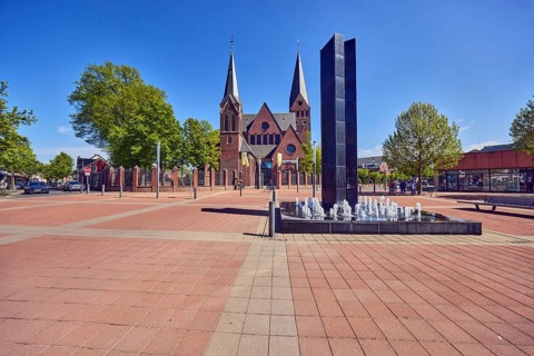 Black Fountain water feature, church tower, parish church, city center, square, barrier bollard,