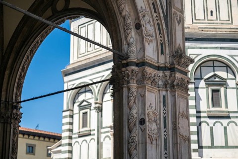 View through an ornate marble arch of the Baptistery of San Giovanni, baptistery, UNESCO World