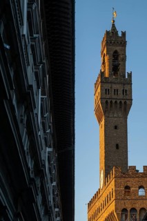 A wing of the Uffizi Gallery, Italian Galleria degli Uffizi, art museum, behind the tower of the
