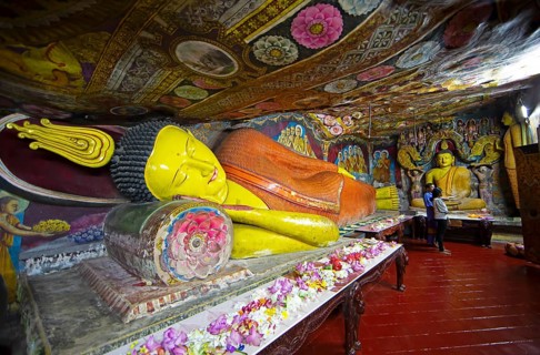 Reclining Buddha in Aluvihara Rock Cave Temple or Cave Monastery, Aluvihara, Matale, Central