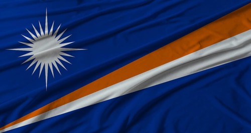 Marshall Islands flag waving. Flag of Marshall Islands with cloth texture
