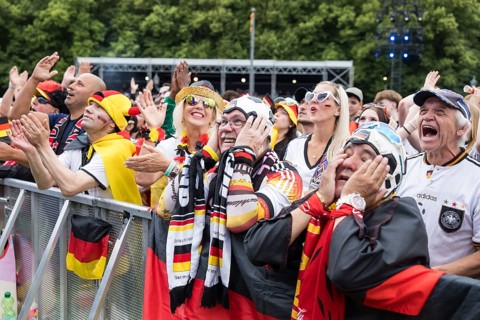 Football fans in the fan zone at the Brandenburg Tor during the quarter-final match between Germany