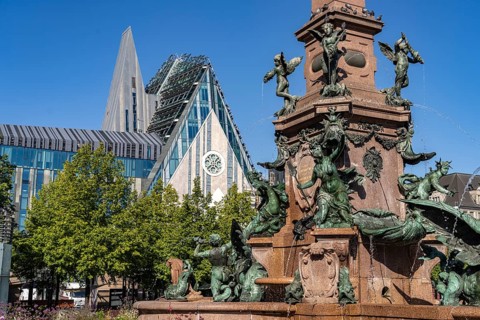 The Mende Fountain and the modern Augusteum of the University of Leipzig on Augustusplatz, Leipzig,