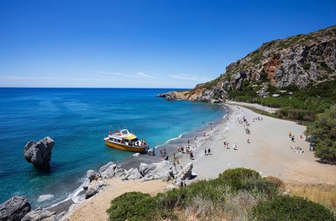 Excursion boat at Preveli Beach at the end of the Kourtaliatiko Gorge, south coast, Crete, Greece