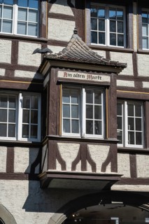 A half-timbered bay on a historic town house on Maximilianstraße in the old town of Lindau,
