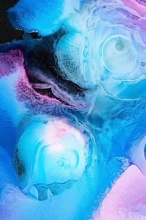 A stunning abstract composition featuring galactic patterns of blue and purple hues. This fluid