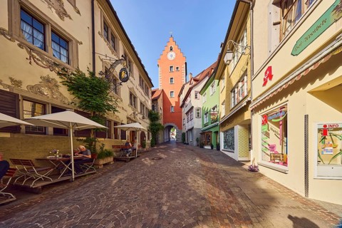 City gate to the Upper Town, historic residential buildings and commercial buildings, street made