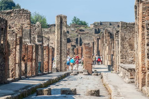 Tourists among ruins in the archaeologic site of Pompei, UNESCO World Heritage Site, province of