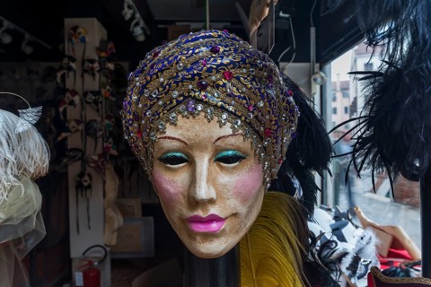 Venetian carnival mask in a shop window, Venice, Veneto, Italy