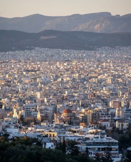 View over houses of Athens in the evening light, Athens, Attica, Greece
