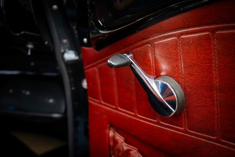 Front door with window crank and red leather trim, vintage car, Volvo Amazon, medium class car from