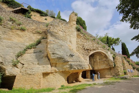 Grotto with cave and geological stone wall, rock face, rocks, mountain village, Gordes, Luberon,