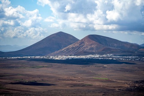 Volcanic crater and volcanic landscape with fields and villages, Lanzarote, Canary Islands, Spain