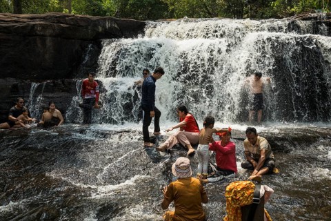 Kulen waterfall with bathing people, Phnom Kulen National Park, Siem Reap, Cambodia