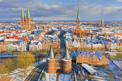 Aerial view over Holsten Gate, St. Mary's and St. Peter's Church and old town of Hanseatic City