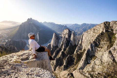 A man takes a rest on the rocky cliffs of Eagleâ€™s Nest in Monterrey, Mexico, after practicing