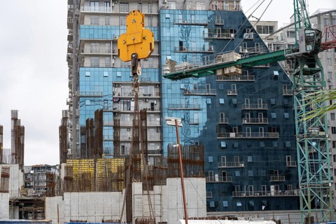 Batumi, Georgia. July 21st 2025. Cranes and construction work on modern high-rise hotel and