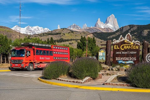 Welcome-sign at mountain village El Chalten, mountain range of Cerro Torre and Cerro Fitz Roy in