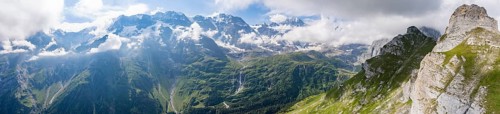 Schmadribachfall waterfall and picturesque mountain landscape with Breithorn mountain peak, view