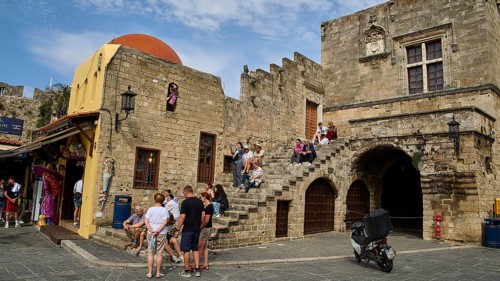 Hippocrates Square, Old Town with stairs and tourists, characterised by medieval architecture,