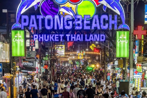 Crowds of people on Bangla Street in the evening. Nightlife on Bangla Walking Street with go-go
