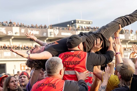 Adenau, Germany, 8 June 2024: Fans crowdsurfing and listening to Billy Talent at Rock am Ring. The