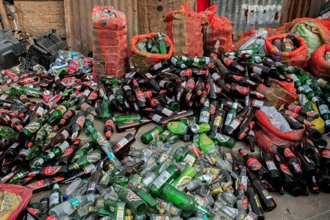 Heap of empty bottles of alcohol intended to be recycled India